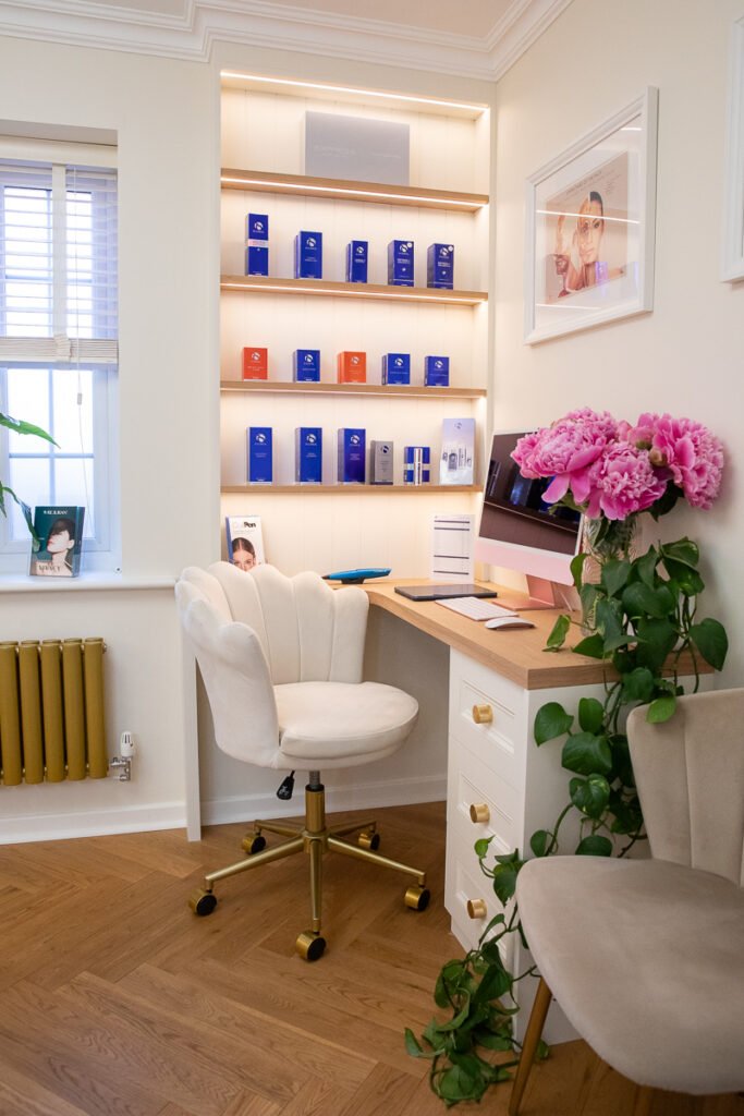 Illuminated bespoke display unit and oak desk in clinic fit-out